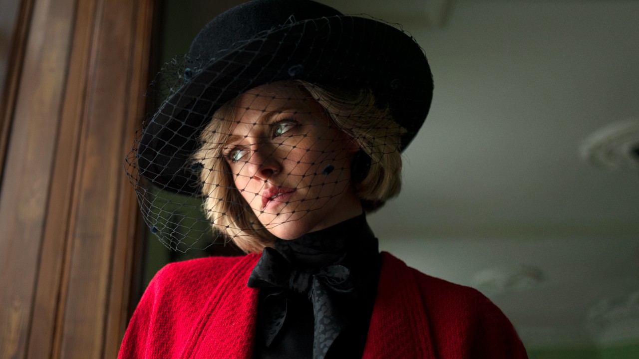 photo of actor Kristen Stewart playing Princess Diana in a red dress and black hat 