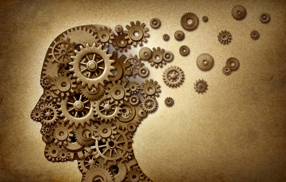 Image of a head in profile, filled with turning cogs
