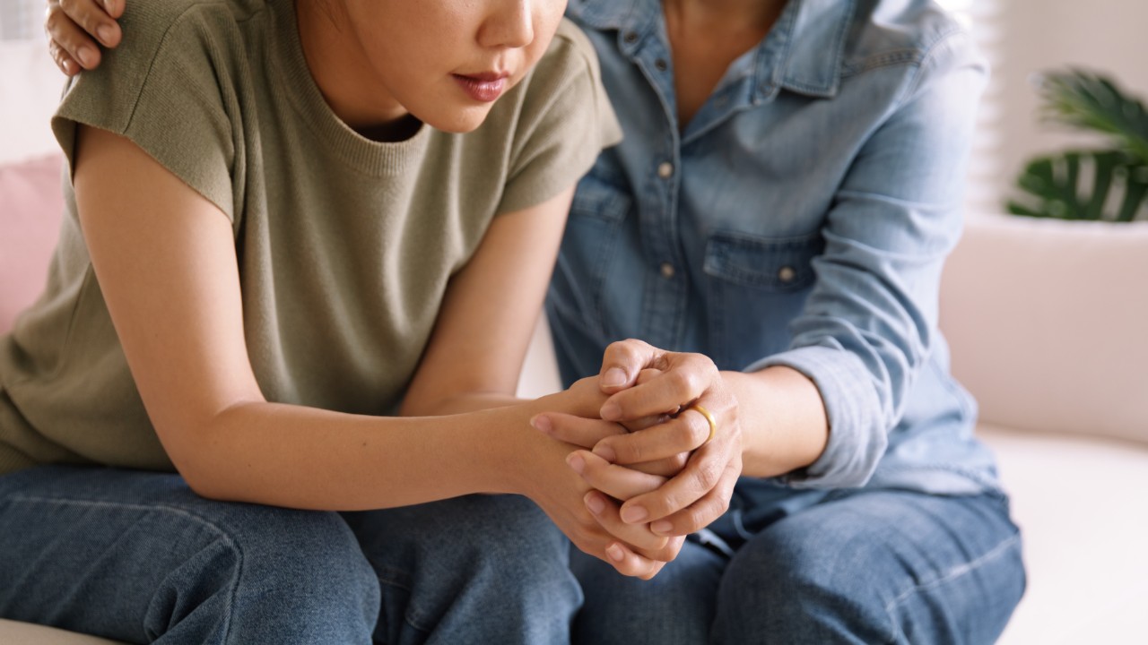 Generic photo showing woman caring for teenager. Source: Adobe