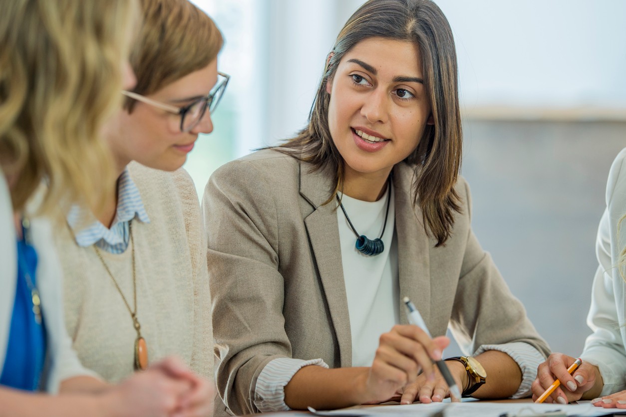 Office workers having a conversation. Image: iStock