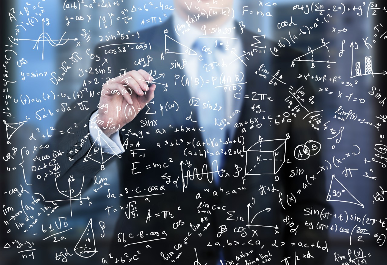 Person writing equations