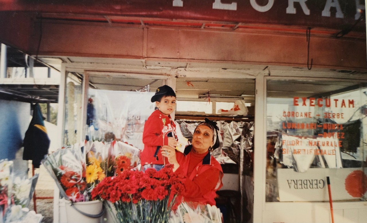 Alex Stan as a child with his grandmother at the family flower shop. 