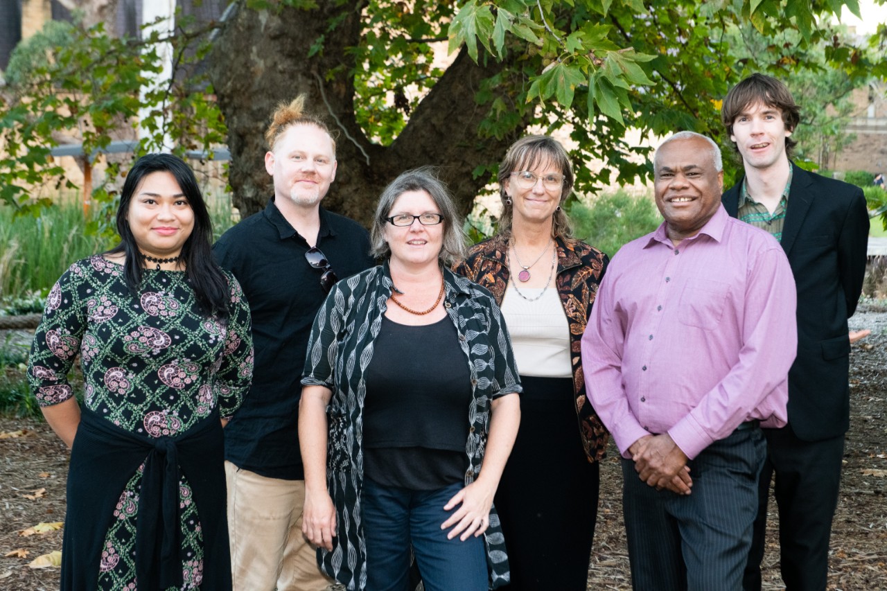 a group of researchers smiling at the camera