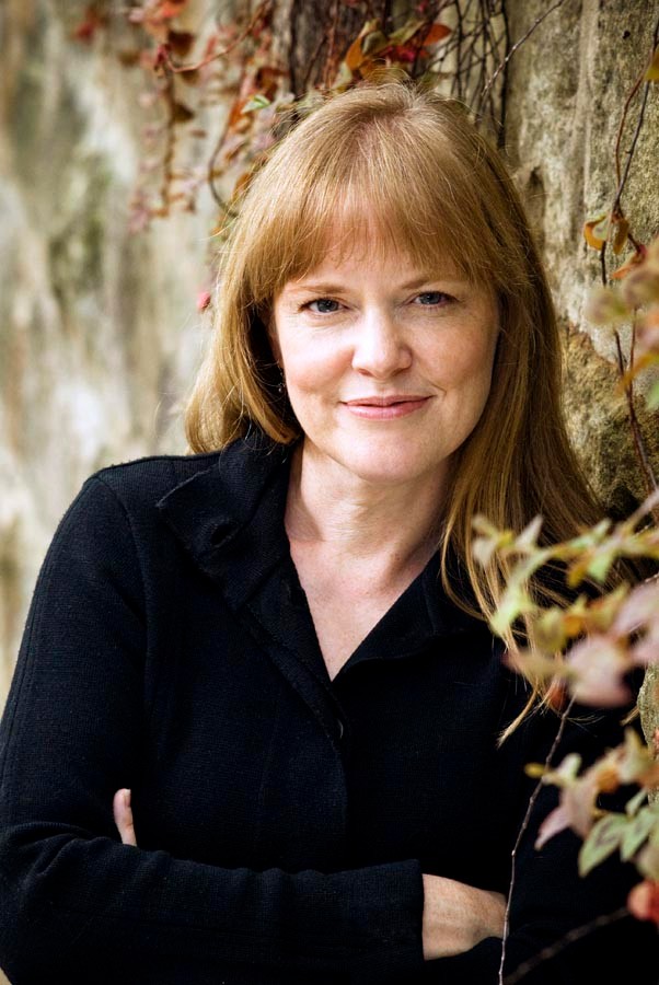 photo of Frances Clarke, a woman with red hair smiling at the camera