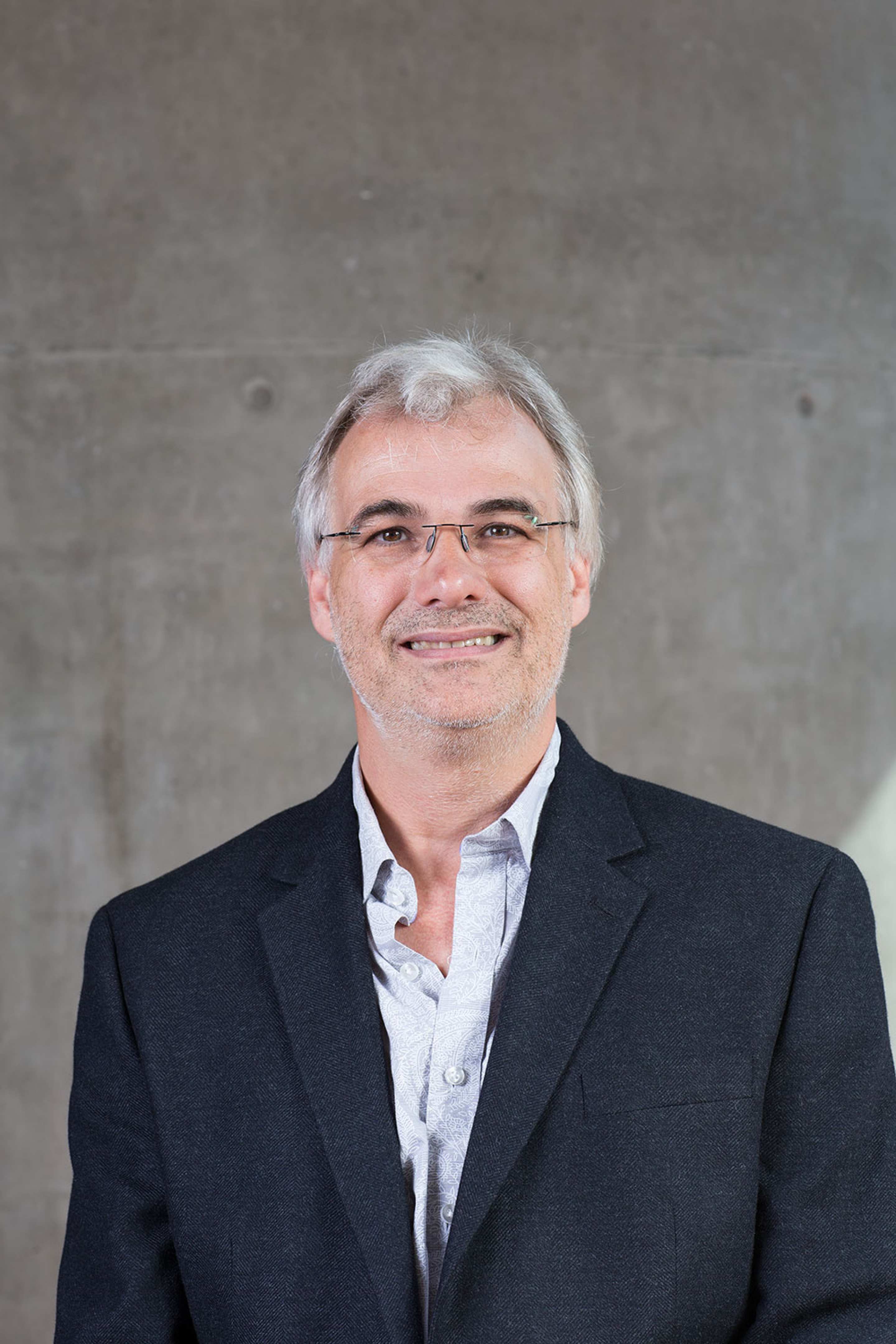 Hans Pol smiling at the camera