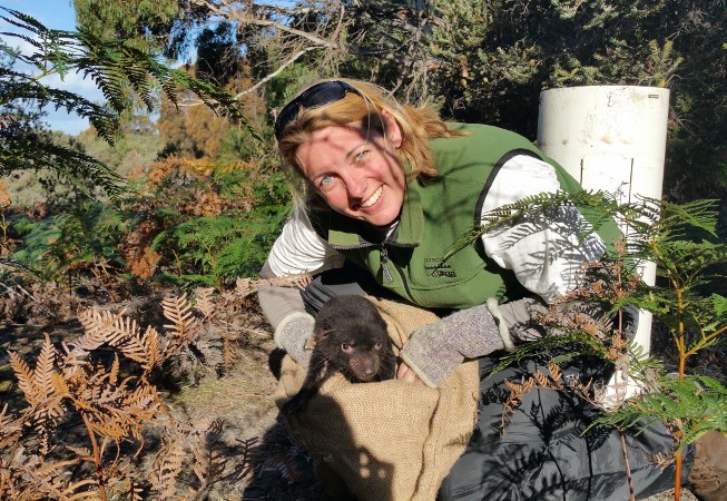 Dr Carolyn Hogg holding a Devil