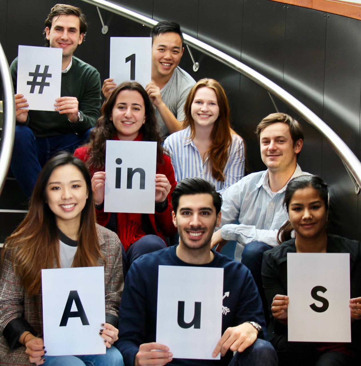 Students holding number 1 sign