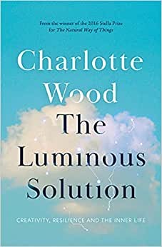 photo of a book cover that is pale blue with a white cloud